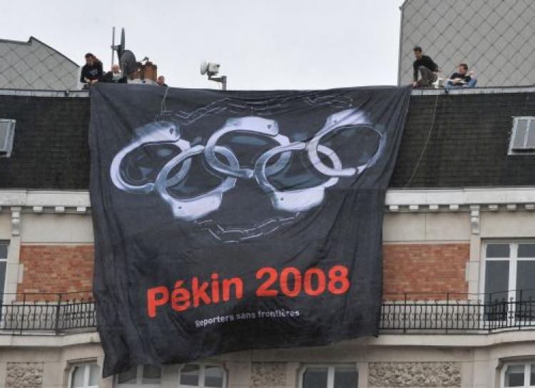 <a><img src="https://www.theepochtimes.com/assets/uploads/2015/09/81631067rsf.jpg" alt="Reporters Without Borders replaced the rings in the traditional Olympics logo with handcuffs as part of a campaign to call for a boycott of the Beijing Olympic Games. (Dominique Faget/AFP/Getty Images))" title="Reporters Without Borders replaced the rings in the traditional Olympics logo with handcuffs as part of a campaign to call for a boycott of the Beijing Olympic Games. (Dominique Faget/AFP/Getty Images))" width="320" class="size-medium wp-image-1834471"/></a>
