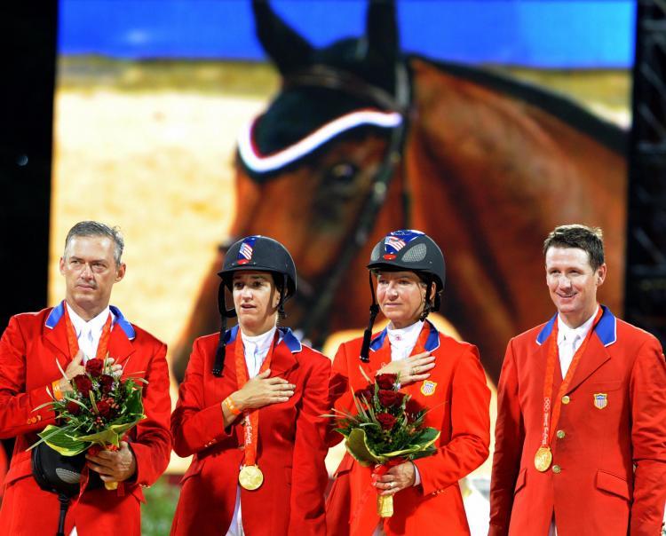<a><img src="https://www.theepochtimes.com/assets/uploads/2015/09/82404483.jpg" alt="From left, Will Simpson, Laura Kraut, Beezie Madden, and Mclain Ward of the U.S. won the Equestrian Show Jumping Gold on Monday. Canada took silver and Norway claimed bronze. (David Hecker/AFP/Getty Images)" title="From left, Will Simpson, Laura Kraut, Beezie Madden, and Mclain Ward of the U.S. won the Equestrian Show Jumping Gold on Monday. Canada took silver and Norway claimed bronze. (David Hecker/AFP/Getty Images)" width="320" class="size-medium wp-image-1834088"/></a>