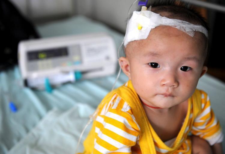 <a><img src="https://www.theepochtimes.com/assets/uploads/2015/09/82944388.jpg" alt="A baby who suffers from kidney stones after drinking tainted milk powder gets IV treatment at a hospital. (China Photos/Getty Images)" title="A baby who suffers from kidney stones after drinking tainted milk powder gets IV treatment at a hospital. (China Photos/Getty Images)" width="320" class="size-medium wp-image-1833534"/></a>