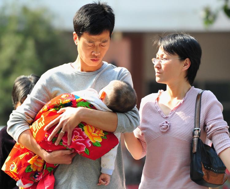 <a><img src="https://www.theepochtimes.com/assets/uploads/2015/09/83352378Scandal.jpg" alt="Parents and their baby leave a children's hospital in Beijing on October 16, 2008. Lawyers for victims of China's tainted milk scandal said the government had warned them not to sue. (Frederic J Brown/AFP/Getty Images)" title="Parents and their baby leave a children's hospital in Beijing on October 16, 2008. Lawyers for victims of China's tainted milk scandal said the government had warned them not to sue. (Frederic J Brown/AFP/Getty Images)" width="320" class="size-medium wp-image-1833255"/></a>