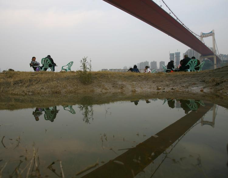 <a><img src="https://www.theepochtimes.com/assets/uploads/2015/09/83848856.jpg" alt="Residents drink tea beneath a bridge across the Yangtze River on November 28, in Chongqing. The Yangtze River has reached its flood peak this week. (China Photos/Getty Images)" title="Residents drink tea beneath a bridge across the Yangtze River on November 28, in Chongqing. The Yangtze River has reached its flood peak this week. (China Photos/Getty Images)" width="320" class="size-medium wp-image-1832729"/></a>