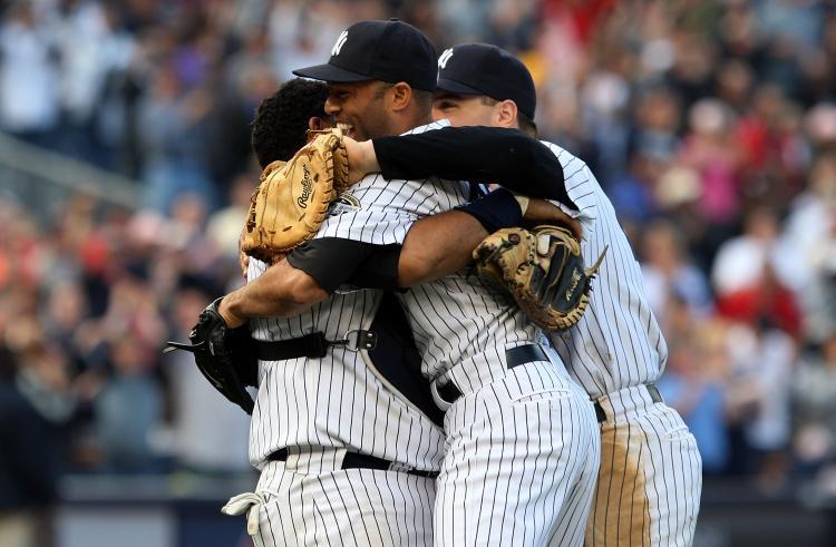 <a><img src="https://www.theepochtimes.com/assets/uploads/2015/09/91195309.jpg" alt="DIVISION CHAMPS: Mariano Rivera, Jose Molina, and Mark Teixeira celebrate after defeating Boston and clinching the AL East. (Jim McIsaac/Getty Images)" title="DIVISION CHAMPS: Mariano Rivera, Jose Molina, and Mark Teixeira celebrate after defeating Boston and clinching the AL East. (Jim McIsaac/Getty Images)" width="320" class="size-medium wp-image-1826051"/></a>