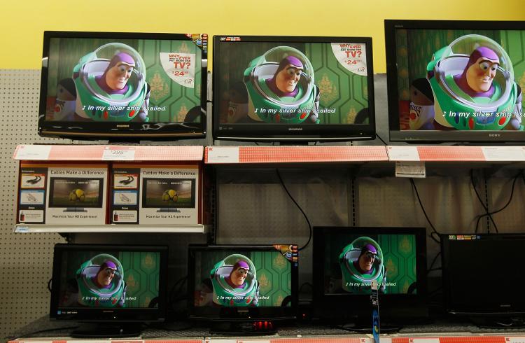 <a><img src="https://www.theepochtimes.com/assets/uploads/2015/09/98770144.jpg" alt="PURSUING STUFF: Flat screen televisions for sale are seen at a retail store April 30 in New York. (Chris Hondros/Getty Images)" title="PURSUING STUFF: Flat screen televisions for sale are seen at a retail store April 30 in New York. (Chris Hondros/Getty Images)" width="320" class="size-medium wp-image-1820368"/></a>