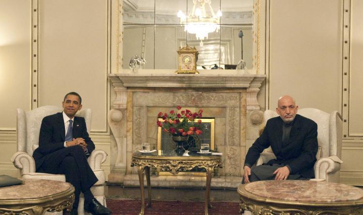 <a><img src="https://www.theepochtimes.com/assets/uploads/2015/09/AFGHANISTAN.jpg" alt="An Afghan policeman frisks two Afghan men. (Joel Saget/AFP/Getty Images)" title="An Afghan policeman frisks two Afghan men. (Joel Saget/AFP/Getty Images)" width="320" class="size-medium wp-image-1821642"/></a>