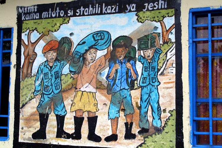<a><img class="size-full wp-image-1773936" src="https://www.theepochtimes.com/assets/uploads/2015/09/DRC_congo.jpg" alt="A picture deploring the recruitment of child soldiers" width="750" height="501"/></a>