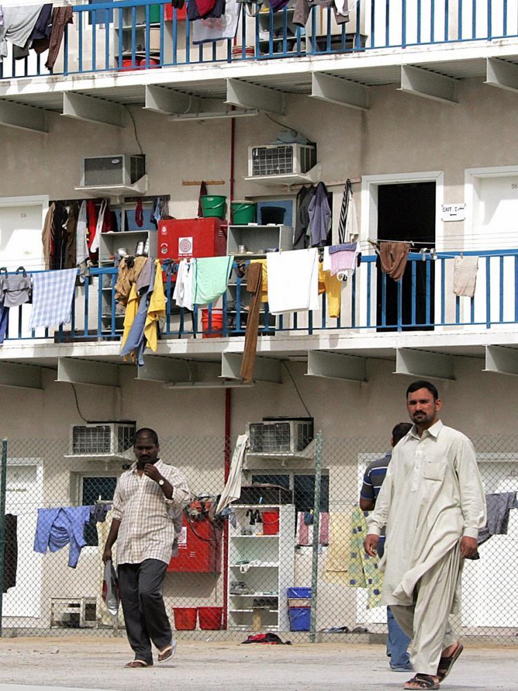 <a><img src="https://www.theepochtimes.com/assets/uploads/2015/09/DUBAI-LABOR-77557333.jpg" alt="LABOR CONDITIONS: Asian workers walking in Sonapur camp in Dubai (file photo, 2006). Seventy ringleaders were arrested on Wednesday for organizing a strike against low wages paid by Arabtec construction company. Foreign workers in Dubai are forced to live in cramped, squalid so-called 'labor camps.' (Rabih Moghrabi/AFP/Getty Images)" title="LABOR CONDITIONS: Asian workers walking in Sonapur camp in Dubai (file photo, 2006). Seventy ringleaders were arrested on Wednesday for organizing a strike against low wages paid by Arabtec construction company. Foreign workers in Dubai are forced to live in cramped, squalid so-called 'labor camps.' (Rabih Moghrabi/AFP/Getty Images)" width="320" class="size-medium wp-image-1809128"/></a>