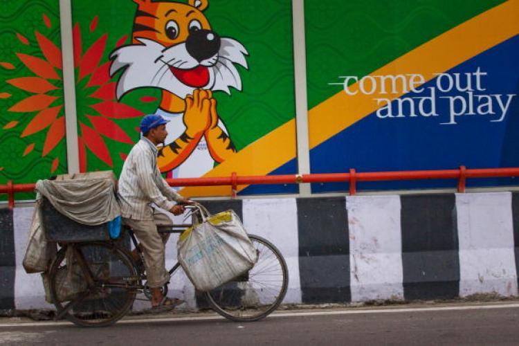 <a><img src="https://www.theepochtimes.com/assets/uploads/2015/09/DelhiGames104379253.jpg" alt="An Indian commuter cycles past a banner for the Commonwealth Games on September 23, 2010, in New Delhi, India. Delhi is scrambling to clean up the athletes' village following numerous complaints from officials. (Daniel Berehulak/Getty Images)" title="An Indian commuter cycles past a banner for the Commonwealth Games on September 23, 2010, in New Delhi, India. Delhi is scrambling to clean up the athletes' village following numerous complaints from officials. (Daniel Berehulak/Getty Images)" width="320" class="size-medium wp-image-1814355"/></a>