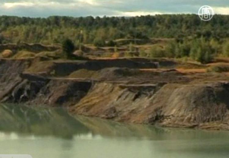 <a><img src="https://www.theepochtimes.com/assets/uploads/2015/09/Dombrovskreservoir.jpg" alt="There is still a great threat that the toxic wastewater could stream into nearby lakes as the chemical wastes in The Dombrovsky reservoir damages the dam that separates the toxic site from the aquifers. (NTDTV)" title="There is still a great threat that the toxic wastewater could stream into nearby lakes as the chemical wastes in The Dombrovsky reservoir damages the dam that separates the toxic site from the aquifers. (NTDTV)" width="320" class="size-medium wp-image-1814014"/></a>