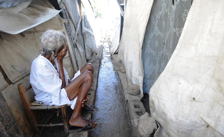 <a><img class="size-large wp-image-1793684" title="Haitian woman near Port-au-Prince" src="https://www.theepochtimes.com/assets/uploads/2015/09/HAITI-WOMAN-136692226-750.jpg" alt="Haitian woman near Port-au-Prince" width="590" height="360"/></a>