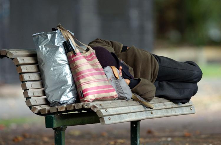 <a><img src="https://www.theepochtimes.com/assets/uploads/2015/09/Homeless.jpg" alt="A homeless person sleeps on a park bench in Victoria Park," title="A homeless person sleeps on a park bench in Victoria Park," width="320" class="size-medium wp-image-1817820"/></a>