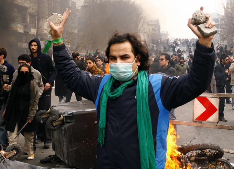 <a><img src="https://www.theepochtimes.com/assets/uploads/2015/09/IRAN95569546.jpg" alt="An Iranian opposition supporter gestures during clashes with security forces in Tehran on Dec. 27, 2009. Eleven people have so far been sentenced to death for taking part in opposition protest. (Amir Sadeghi/AFP PHOTO)" title="An Iranian opposition supporter gestures during clashes with security forces in Tehran on Dec. 27, 2009. Eleven people have so far been sentenced to death for taking part in opposition protest. (Amir Sadeghi/AFP PHOTO)" width="320" class="size-medium wp-image-1822464"/></a>