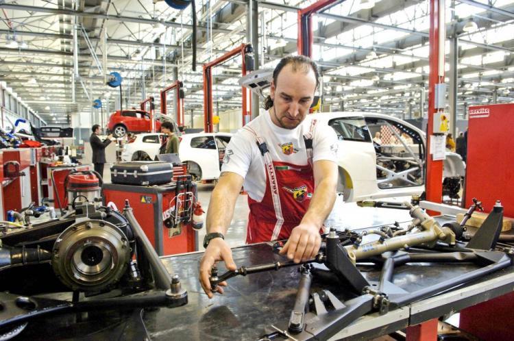 <a><img src="https://www.theepochtimes.com/assets/uploads/2015/09/ITALYFACTORY-C.jpg" alt="An employee works in a Fiat Abarth factory in Turin, Italy. (Luigi Bertello/AFP/Getty Images)" title="An employee works in a Fiat Abarth factory in Turin, Italy. (Luigi Bertello/AFP/Getty Images)" width="320" class="size-medium wp-image-1823588"/></a>