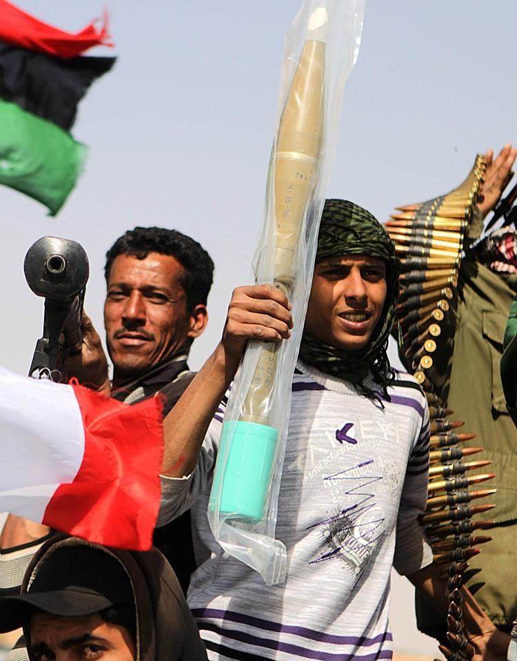 <a><img src="https://www.theepochtimes.com/assets/uploads/2015/09/LIBYA-110936690-COLOR.jpg" alt="MADE IN CHINA? Libyan rebels raise a brand new rocket propelled grenade and ammunition they took from abandoned pro-Gadhafi forces ammunition stocks on March 27. (PATRICK BAZ/AFP/Getty Images)" title="MADE IN CHINA? Libyan rebels raise a brand new rocket propelled grenade and ammunition they took from abandoned pro-Gadhafi forces ammunition stocks on March 27. (PATRICK BAZ/AFP/Getty Images)" width="320" class="size-medium wp-image-1798253"/></a>