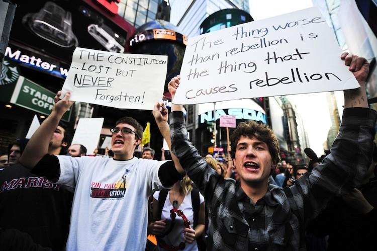 <a><img src="https://www.theepochtimes.com/assets/uploads/2015/09/OccupyDUNANDAFPGettyImages.jpg" alt="Occupy Wall Street participants stage a protest on Times Square in New York on Oct. 15. (Emmanuel Dunand/Getty Images)" title="Occupy Wall Street participants stage a protest on Times Square in New York on Oct. 15. (Emmanuel Dunand/Getty Images)" width="575" class="size-medium wp-image-1796303"/></a>