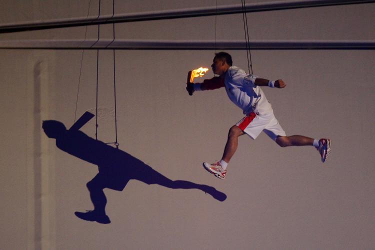 <a><img src="https://www.theepochtimes.com/assets/uploads/2015/09/TorchLighter_82219767.jpg" alt="HUNG UP: Li Ning, former Olympic gymnast for China flys through the air on his way to lighting the Olympic Flame during the Opening Ceremony for the 2008 Beijing Summer Olympics at the National Stadium on August 8, 2008 in Beijing, China. (Phil Walter/Getty Images)" title="HUNG UP: Li Ning, former Olympic gymnast for China flys through the air on his way to lighting the Olympic Flame during the Opening Ceremony for the 2008 Beijing Summer Olympics at the National Stadium on August 8, 2008 in Beijing, China. (Phil Walter/Getty Images)" width="320" class="size-medium wp-image-1834135"/></a>