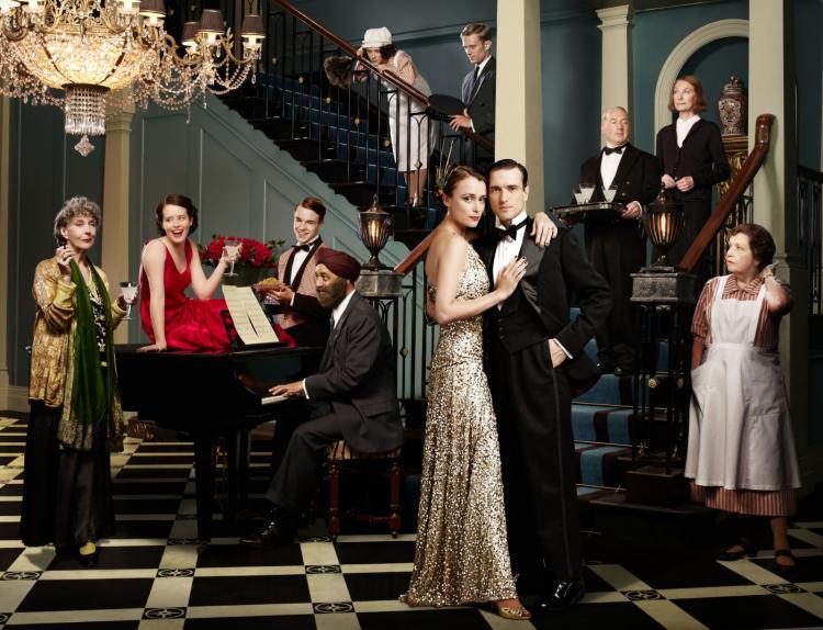 <a><img src="https://www.theepochtimes.com/assets/uploads/2015/09/UDiconic2.jpg" alt="UPSTAIRS DOWNSTAIRS: An updated version of the series from the 1970s, 'Upstairs Downstairs'.(L-R) Eileen Atkins as Lady Maud Holland, Claire Foy as Lady Persie, Nico Mirallegro as Johnny Proude, Art Malik as Amanjit Singh, Ellie Kendrick as Ivy Morris, Neil Jackson as Harry Spargo, Keeley Hawes as Lady Agnes Holland, Ed Stoppard as Sir Hallam Holland, Adrian Scarborough as Mr. Pritchard, Jean Marsh as Rose Buck, and Anne Reid as Mrs. Thackeray. (Courtesy of BBC Masterpiece)" title="UPSTAIRS DOWNSTAIRS: An updated version of the series from the 1970s, 'Upstairs Downstairs'.(L-R) Eileen Atkins as Lady Maud Holland, Claire Foy as Lady Persie, Nico Mirallegro as Johnny Proude, Art Malik as Amanjit Singh, Ellie Kendrick as Ivy Morris, Neil Jackson as Harry Spargo, Keeley Hawes as Lady Agnes Holland, Ed Stoppard as Sir Hallam Holland, Adrian Scarborough as Mr. Pritchard, Jean Marsh as Rose Buck, and Anne Reid as Mrs. Thackeray. (Courtesy of BBC Masterpiece)" width="320" class="size-medium wp-image-1805780"/></a>