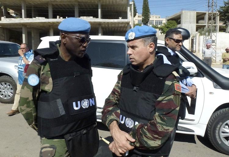 <a><img class="size-large wp-image-1787190" title=" Moroccan Colonel Ahmed Himmiche, head of the UN observers' advance team (R) speaks with Senegalese Lieutenant-General Babacar Gaye, military adviser of the UN secretary general (L) in Zabadani, northwest Damascus on May 20. (-/AFP/GettyImages)" src="https://www.theepochtimes.com/assets/uploads/2015/09/UN144888346.jpg" alt="" width="590" height="405"/></a>