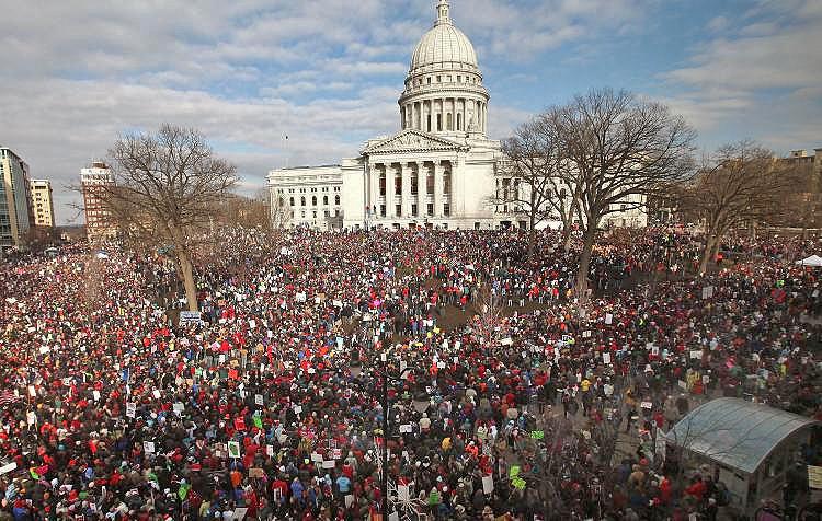 <a><img src="https://www.theepochtimes.com/assets/uploads/2015/09/Union-110028781.jpg" alt="Thousands of demonstrators protest outside the Wisconsin State Capitol on March 12 to voice their opposition to Gov. Scott Walker's budget bill, which essentially eliminated collective bargaining rights for state workers. (Scott Olson/Getty Images)" title="Thousands of demonstrators protest outside the Wisconsin State Capitol on March 12 to voice their opposition to Gov. Scott Walker's budget bill, which essentially eliminated collective bargaining rights for state workers. (Scott Olson/Getty Images)" width="320" class="size-medium wp-image-1803554"/></a>