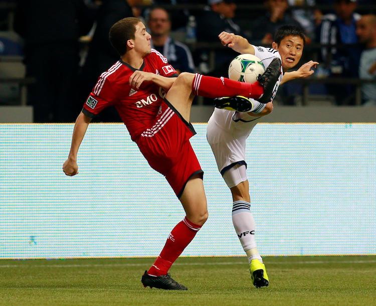 <a><img class="size-full wp-image-1769694" title="Toronto FC v Vancouver Whitecaps" src="https://www.theepochtimes.com/assets/uploads/2015/09/VANvTOR162978660.jpg" alt="Hogan Ephraim of Toronto FC (L) and Young-Pyo Lee of Vancouver Whitecaps FC compete for the ball during their MLS game at BC Place March 2, 2013 in Vancouver, British Columbia, Canada. (Jeff Vinnick/Getty Images)" width="750" height="610"/></a>