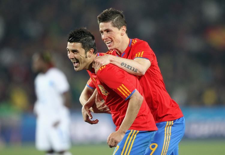<a><img src="https://www.theepochtimes.com/assets/uploads/2015/09/Villa102277614.jpg" alt="David Villa (left) is congratulated by fellow striker Fernando Torres after giving Spain a two-goal lead against Honduras on Monday. (Christof Koepsel/Getty Images)" title="David Villa (left) is congratulated by fellow striker Fernando Torres after giving Spain a two-goal lead against Honduras on Monday. (Christof Koepsel/Getty Images)" width="320" class="size-medium wp-image-1818353"/></a>