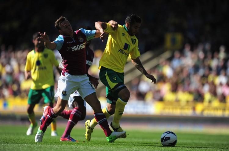 <a><img class="size-full wp-image-1781867" title="Norwich City v West Ham United - Premier League" src="https://www.theepochtimes.com/assets/uploads/2015/09/WestHam-Norwich152011005.jpg" alt="West Ham's Mark Noble (L) and Norwich's Robert Snodgrass battle for possession in Saturday's early English Premier League action. (Jamie McDonald/Getty Images) " width="750" height="495"/></a>