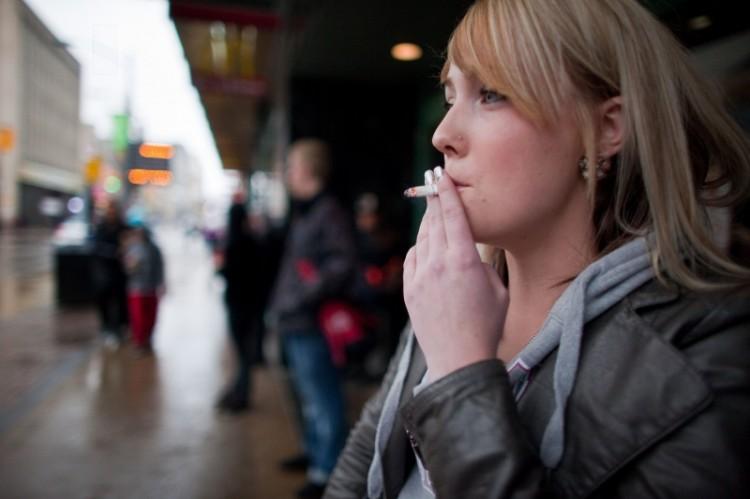 <a><img class="size-full wp-image-1772437" title="A woman smokes a cigarette on March 12," src="https://www.theepochtimes.com/assets/uploads/2015/09/a141187617.jpg" alt="" width="750" height="499"/></a>