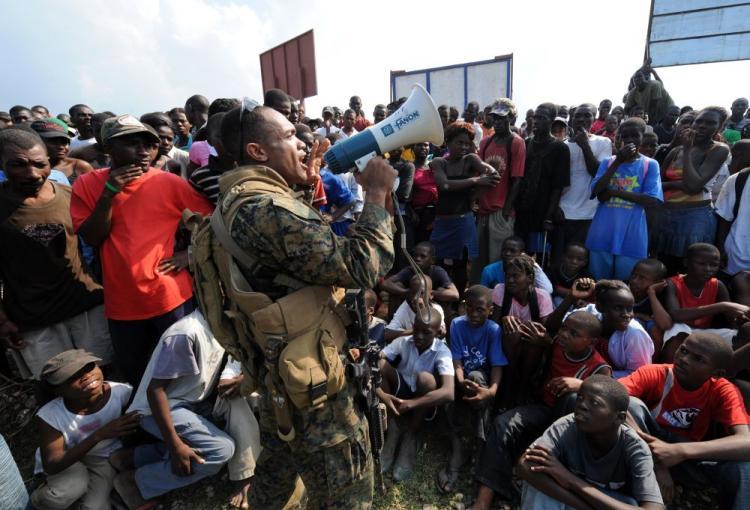 <a><img src="https://www.theepochtimes.com/assets/uploads/2015/09/after95902337logistics.jpg" alt="Haitian earthquake victims listen to a U.S. Marine in Leogan on Jan. 20. The logistics of transporting needed supplies is an ongoing dilemma in Haiti which was hit by a 6.1 magnitude aftershock early Wednesday morning. (Jewel Samad/AFP/Getty Images)" title="Haitian earthquake victims listen to a U.S. Marine in Leogan on Jan. 20. The logistics of transporting needed supplies is an ongoing dilemma in Haiti which was hit by a 6.1 magnitude aftershock early Wednesday morning. (Jewel Samad/AFP/Getty Images)" width="320" class="size-medium wp-image-1823807"/></a>