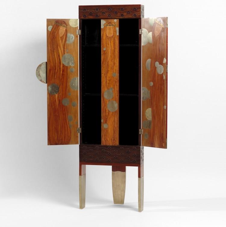 <a><img src="https://www.theepochtimes.com/assets/uploads/2015/09/artsVic.jpg" alt="The enchanted princesses, corner cabinet, 1900, Koloman Moser (designer.) (Courtesy of a private collection, Portola Valley, California)" title="The enchanted princesses, corner cabinet, 1900, Koloman Moser (designer.) (Courtesy of a private collection, Portola Valley, California)" width="275" class="size-medium wp-image-1801693"/></a>