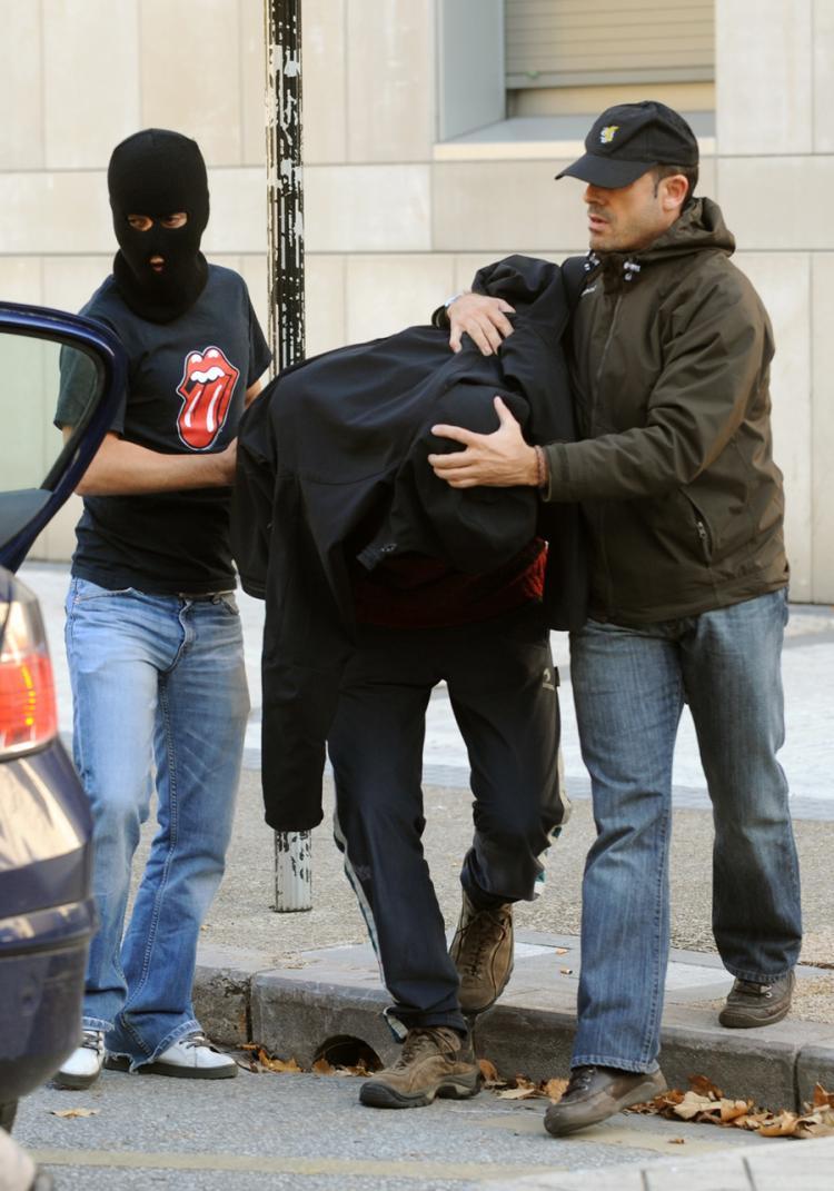 <a><img src="https://www.theepochtimes.com/assets/uploads/2015/09/basque-93348899-small.jpg" alt="An unidentified person (C), suspected of being a member of Segi, an outlawed youth group believed to have ties to the armed Basque separatist group ETA, is escorted to a police car on November 24, 2009, in the northern Spanish Basque city of San Sebastian. (Rafa Rivas/Getty Images)" title="An unidentified person (C), suspected of being a member of Segi, an outlawed youth group believed to have ties to the armed Basque separatist group ETA, is escorted to a police car on November 24, 2009, in the northern Spanish Basque city of San Sebastian. (Rafa Rivas/Getty Images)" width="320" class="size-medium wp-image-1825070"/></a>