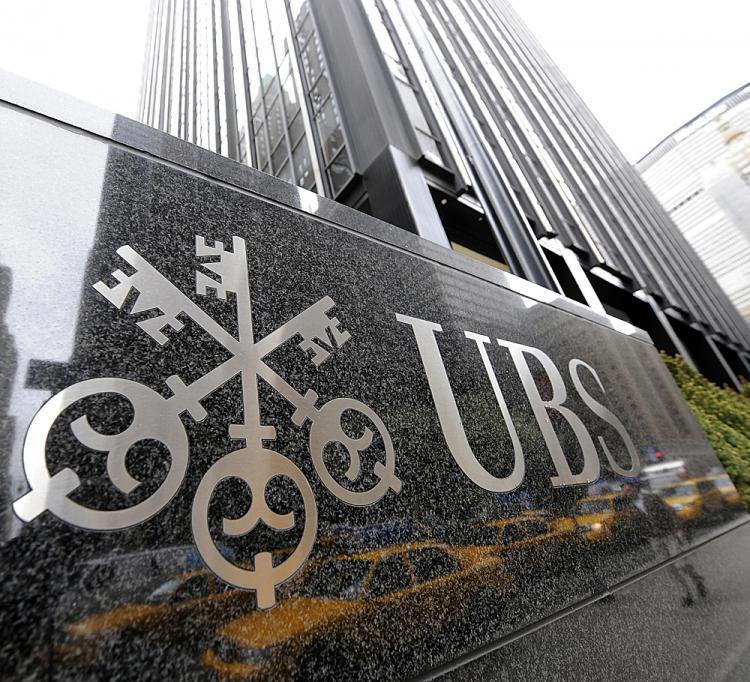 <a><img src="https://www.theepochtimes.com/assets/uploads/2015/09/bus85989373.jpg" alt="The UBS Park Avenue building in New York April 15, 2009. Embattled Swiss bank UBS on Wednesday said it would slash 8,700 jobs in a bid to cut costs after it reported fresh losses for the first three months of this year. (Timothy A. Clary/AFP/Getty Images)" title="The UBS Park Avenue building in New York April 15, 2009. Embattled Swiss bank UBS on Wednesday said it would slash 8,700 jobs in a bid to cut costs after it reported fresh losses for the first three months of this year. (Timothy A. Clary/AFP/Getty Images)" width="320" class="size-medium wp-image-1828731"/></a>
