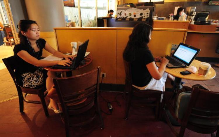 <a><img src="https://www.theepochtimes.com/assets/uploads/2015/09/chcy88875436.jpg" alt="Women use their laptop computers at a wireless cafe in Beijing. (Frederic J. Brown/AFP/Getty Images)" title="Women use their laptop computers at a wireless cafe in Beijing. (Frederic J. Brown/AFP/Getty Images)" width="320" class="size-medium wp-image-1817376"/></a>