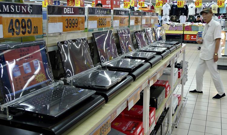 <a><img src="https://www.theepochtimes.com/assets/uploads/2015/09/chincc88384964.jpg" alt="A man walks next to a row of laptops displayed at a supermarket in Beijing, June 10, 2009. (Liu Jin/AFP/Getty Images)" title="A man walks next to a row of laptops displayed at a supermarket in Beijing, June 10, 2009. (Liu Jin/AFP/Getty Images)" width="320" class="size-medium wp-image-1827859"/></a>