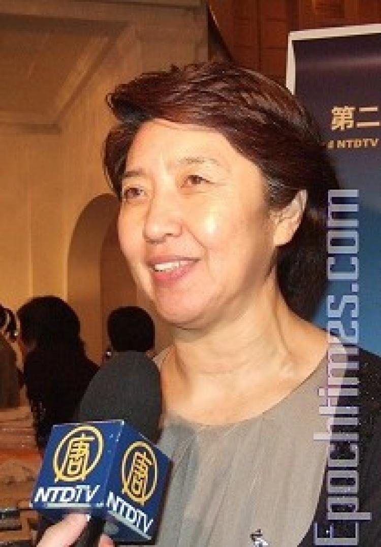 <a><img src="https://www.theepochtimes.com/assets/uploads/2015/09/dens.jpg" alt="Lily from New York says she was very moved by the dances.  (Li Xin/Epoch Times)" title="Lily from New York says she was very moved by the dances.  (Li Xin/Epoch Times)" width="320" class="size-medium wp-image-1833902"/></a>