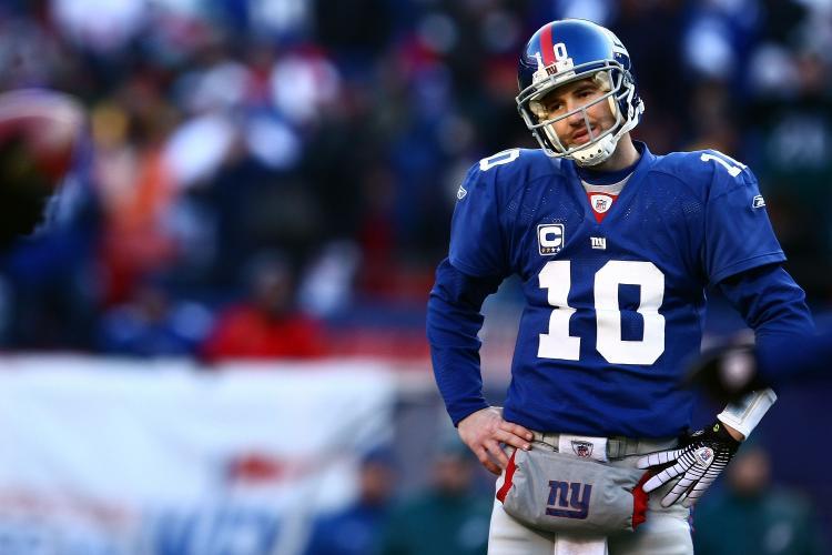 <a><img src="https://www.theepochtimes.com/assets/uploads/2015/09/eli.jpg" alt="DISAPPOINTMENT: Eli Manning had a rough day, throwing two interceptions, one of which was returned to the Giants goal line setting up an Eagles score. (Chris McGrath/Getty Images)" title="DISAPPOINTMENT: Eli Manning had a rough day, throwing two interceptions, one of which was returned to the Giants goal line setting up an Eagles score. (Chris McGrath/Getty Images)" width="320" class="size-medium wp-image-1831422"/></a>