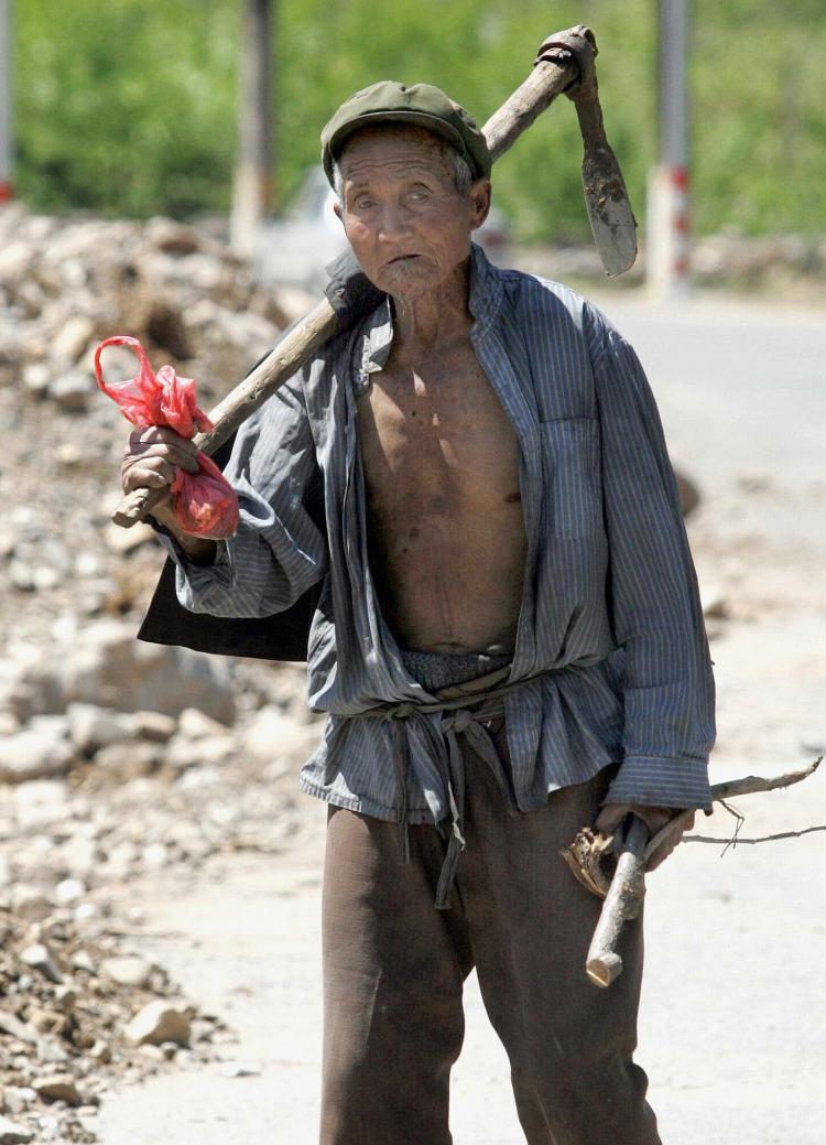 <a><img src="https://www.theepochtimes.com/assets/uploads/2015/09/farmer_74196823.jpg" alt="An elderly Chinese farmer in the outskirts of Beijing, 2007. (STR/AFP/Getty Images)" title="An elderly Chinese farmer in the outskirts of Beijing, 2007. (STR/AFP/Getty Images)" width="320" class="size-medium wp-image-1834477"/></a>