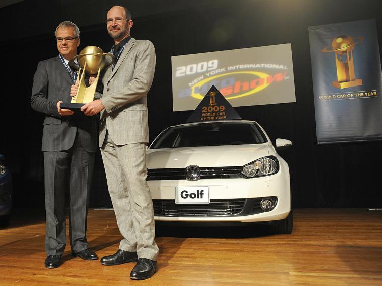 <a><img class="size-medium wp-image-1828857" title="Volkswagen America President Stephen Jacoby (L) and Klaus Bischoff, Dorector Volkswagen Design, hold the trophy a they pose with the Volkswagen Golf, Named the 2009 World Car of the Year at the New York International Auto Show. (Stan Honda/AFP/Getty Images)" src="https://www.theepochtimes.com/assets/uploads/2015/09/goglgkl85872938.jpg" alt="Volkswagen America President Stephen Jacoby (L) and Klaus Bischoff, Dorector Volkswagen Design, hold the trophy a they pose with the Volkswagen Golf, Named the 2009 World Car of the Year at the New York International Auto Show. (Stan Honda/AFP/Getty Images)" width="320"/></a>