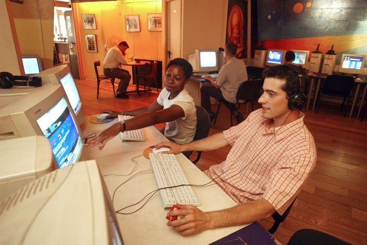 Patrons surf the Internet in a cafe in Paris. In recent years, a wave of dramatic changes started to take place for the Internet. (Eric Feferberg/AFP/Getty Images)