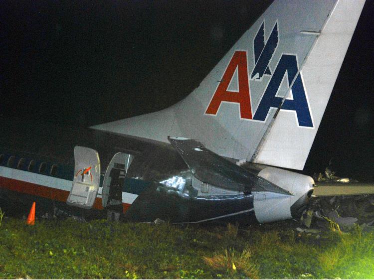 <a><img src="https://www.theepochtimes.com/assets/uploads/2015/09/jami95062840.jpg" alt="An American Airlines jet is seen after overshooting the runway at Norman Manley International Airport in Kingston, Jamaica on December 22, 2009. (Anthony Foster/AFP/Getty Images)" title="An American Airlines jet is seen after overshooting the runway at Norman Manley International Airport in Kingston, Jamaica on December 22, 2009. (Anthony Foster/AFP/Getty Images)" width="320" class="size-medium wp-image-1824523"/></a>