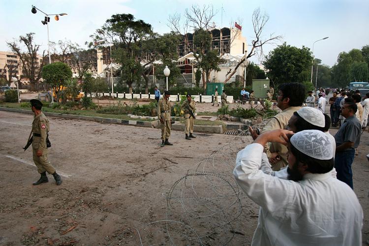 <a><img src="https://www.theepochtimes.com/assets/uploads/2015/09/pakaka82932690.jpg" alt="EVACUATION: People stand next to the crater left by a bomb blast next to the Marriott Hotel in Islamabad after a suicide truck bombing destroyed the hotel. In a recent development, U.N. family members have been evacuated from Pakistan after an escalation (Pedro Ugarte/AFP/Getty Images)" title="EVACUATION: People stand next to the crater left by a bomb blast next to the Marriott Hotel in Islamabad after a suicide truck bombing destroyed the hotel. In a recent development, U.N. family members have been evacuated from Pakistan after an escalation (Pedro Ugarte/AFP/Getty Images)" width="320" class="size-medium wp-image-1833481"/></a>