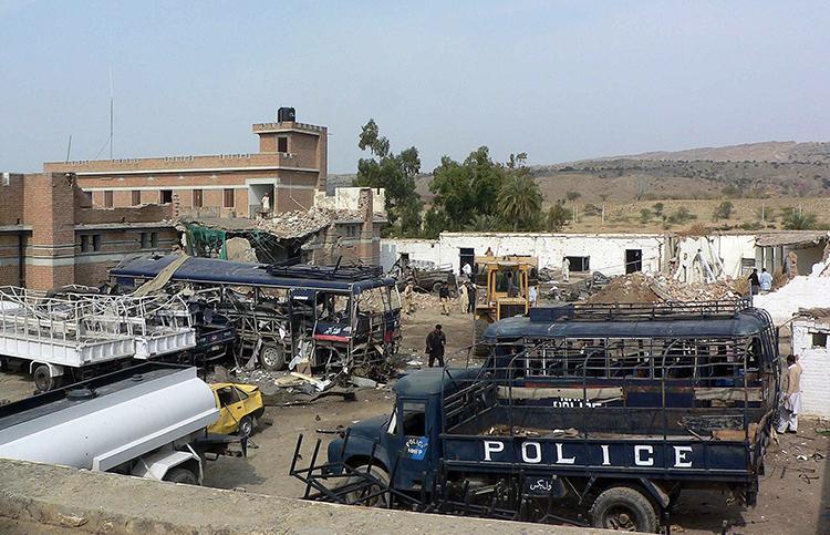 <a><img src="https://www.theepochtimes.com/assets/uploads/2015/09/pakistan_97130220.jpg" alt="Pakistani security officials stand beside wreckage and a damaged police station building after a suicide bomb attack in Karak, southeast of Peshawar, in February 2010. (Karim Ullah/AFP/Getty Images)" title="Pakistani security officials stand beside wreckage and a damaged police station building after a suicide bomb attack in Karak, southeast of Peshawar, in February 2010. (Karim Ullah/AFP/Getty Images)" width="320" class="size-medium wp-image-1810719"/></a>