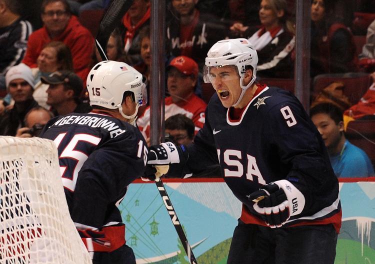 <a><img src="https://www.theepochtimes.com/assets/uploads/2015/09/parise97029652.jpg" alt="AMERICAN DEVILS: Zach Parise (right) celebrates with his captain Jamie Langenbrunner after scoring against the Swiss on Wednesday. (Luis Acosta/AFP/Getty Images)" title="AMERICAN DEVILS: Zach Parise (right) celebrates with his captain Jamie Langenbrunner after scoring against the Swiss on Wednesday. (Luis Acosta/AFP/Getty Images)" width="320" class="size-medium wp-image-1822694"/></a>