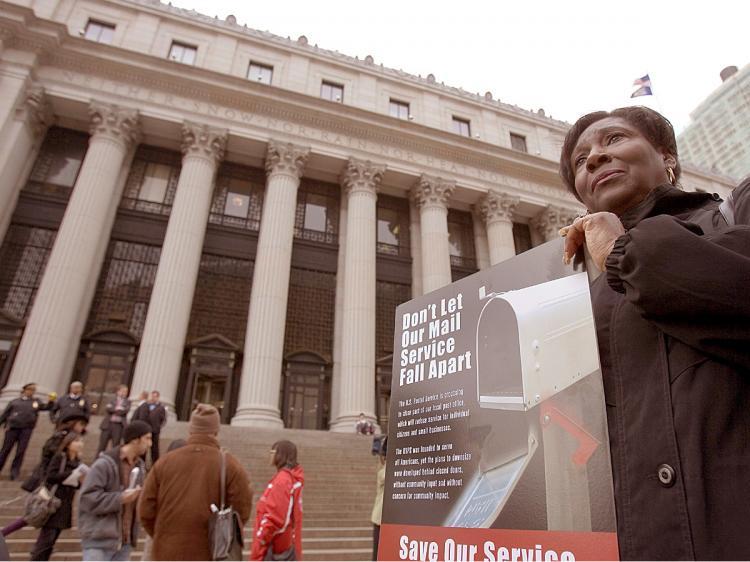<a><img src="https://www.theepochtimes.com/assets/uploads/2015/09/post.jpg" alt="GOING POSTAL: A postal worker protests proposed cuts by the Postal Service outside the Farley Main Post Office on 8th Avenue. (Edward Dai/The Epoch Times)" title="GOING POSTAL: A postal worker protests proposed cuts by the Postal Service outside the Farley Main Post Office on 8th Avenue. (Edward Dai/The Epoch Times)" width="320" class="size-medium wp-image-1828723"/></a>