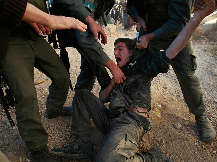 <a><img src="https://www.theepochtimes.com/assets/uploads/2015/09/qwank83913095.jpg" alt="Israeli police struggle to restrain a right-wing Jewish settler as they evacuate Israeli extremists from a disputed house in the West Bank city of Hebron, December 4, 2008. (David Silverman/Getty Images)" title="Israeli police struggle to restrain a right-wing Jewish settler as they evacuate Israeli extremists from a disputed house in the West Bank city of Hebron, December 4, 2008. (David Silverman/Getty Images)" width="320" class="size-medium wp-image-1832590"/></a>