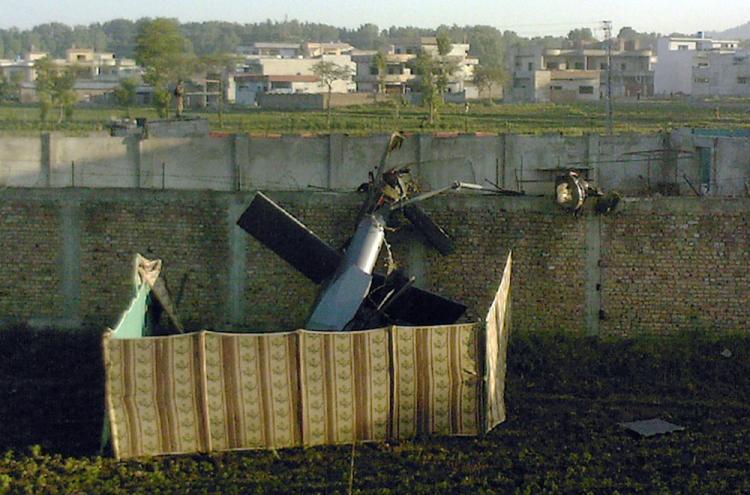 <a><img src="https://www.theepochtimes.com/assets/uploads/2015/09/stealth_helicopter_113394759.jpg" alt="Stealth helicopter? A crashed military helicopter is seen near the hideout of al-Qaeda leader Osama bin Laden after a ground operation by U.S. Special Forces in Abbottabad, Pakistan on May 2. (STR/AFP/Getty Images)" title="Stealth helicopter? A crashed military helicopter is seen near the hideout of al-Qaeda leader Osama bin Laden after a ground operation by U.S. Special Forces in Abbottabad, Pakistan on May 2. (STR/AFP/Getty Images)" width="320" class="size-medium wp-image-1804434"/></a>