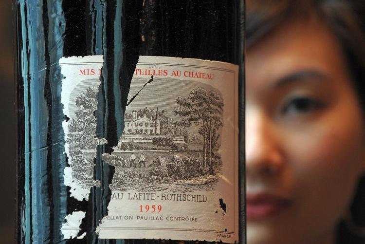 <a><img src="https://www.theepochtimes.com/assets/uploads/2015/09/wine96608623.jpg" alt="A model shows a bottle of a bottle of Chateau Lafite Rothschild (about US$20-30,000) at an auction preview in Hong Kong on January 28. Alarm bells are ringing over possible fraud involving Chinese wine. (Mike Clarke/AFP/Getty Images)" title="A model shows a bottle of a bottle of Chateau Lafite Rothschild (about US$20-30,000) at an auction preview in Hong Kong on January 28. Alarm bells are ringing over possible fraud involving Chinese wine. (Mike Clarke/AFP/Getty Images)" width="320" class="size-medium wp-image-1820351"/></a>