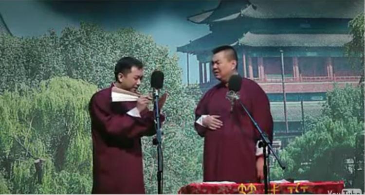 <a><img src="https://www.theepochtimes.com/assets/uploads/2015/09/xiangsheng.jpg" alt="BOLD: A screen grab of the video shows Wang (L) using a traditional fan as a prop as he jokes with Zhang (R) in a performance that heavily satirized communist authorities. (The Epoch Times)" title="BOLD: A screen grab of the video shows Wang (L) using a traditional fan as a prop as he jokes with Zhang (R) in a performance that heavily satirized communist authorities. (The Epoch Times)" width="320" class="size-medium wp-image-1805249"/></a>