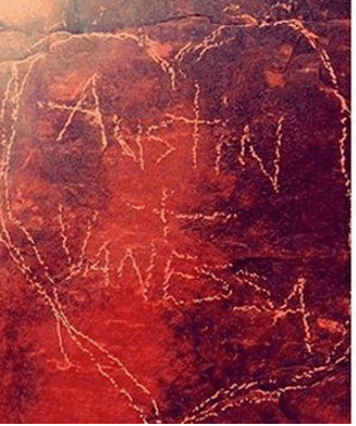 Carving of heart with Vanessa and Austin's names within.
