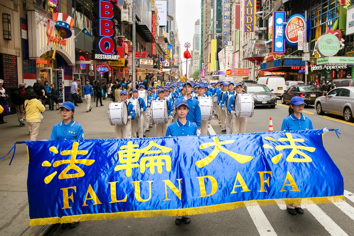 The Tian Guo Marching Band performs in the World Falun Dafa Day Day parade along 42nd Street in New York, on May 13, 2016. (Samira Bouaou/Epoch Times)