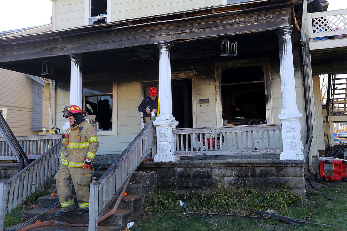 Firefighters work at a house where four children died in a house fire in the 100 block of East Columbia Street in Flora, Ind., on Nov. 21, 2016. (Tim Bath/Kokomo Tribune via AP)