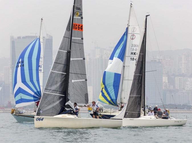Steve Bourne helming 'Merlin' (064) during the RHKYC's Lipton Trophy race in Victoria Harbour on Saturday Dec 3, 2016. (RHKYC / Guy Nowell)